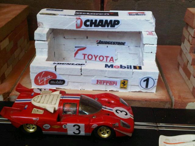 Scalextric Pits, Control Building, Restaurant, Grandstand. Similar to original range of plastic Scalextric Goodwood race buildings but in clay - built from mini bricks, painted (or not) and decals added.