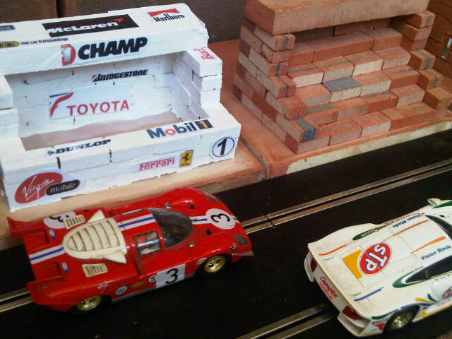 Scalextric Buildings. Pits. Also Control Building, Restaurant, Grandstand. Similar to original range of plastic Scalextric Goodwood race buildings but in clay - built from mini bricks, painted (or not) and decals added.