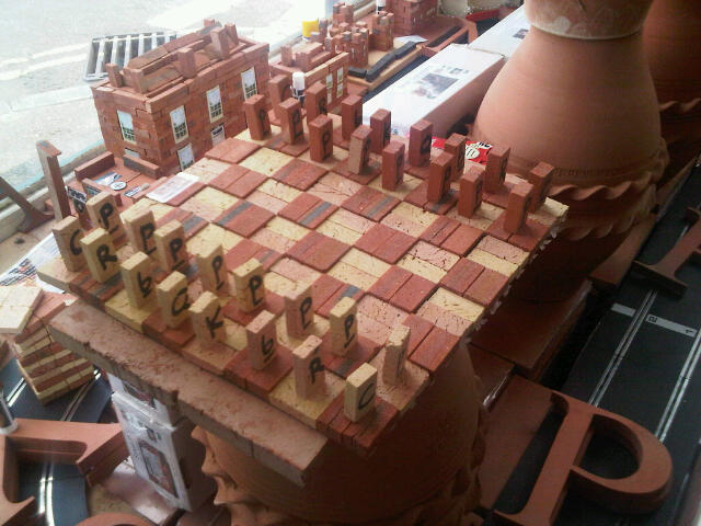 Terracotta Mini Brick Chess Set with mini brick lettered playing pieces. 