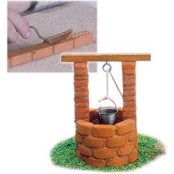 Toy brick kits including reuseable mortar.Construct different buildings from real bricks and cement. Includes, in most kits, bricks, cement with bowl and trowel, plastic doors / windows,  board to construct the models on and drawings for different building plans.