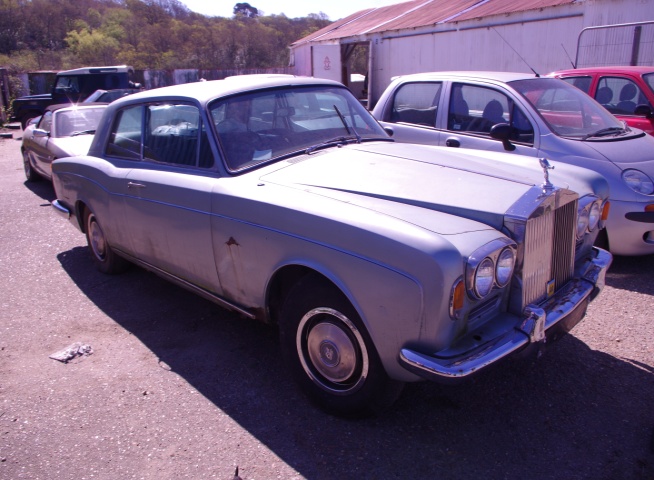 As received in April 2015. Silver Mink Rolls-Royce Corniche FHC 1971 Chassis No CRH 11573 One of only 1,100 produced 88,000 miles unused since 1988 with full historical build records.Interior blue leather  Brake and suspension overhaul, new sills  Full bare metal body respray. 4 New Whitewall tyres. Should be finished and MOT'd by end of 2016. Very much an appreciating investment Priced at over £30,000