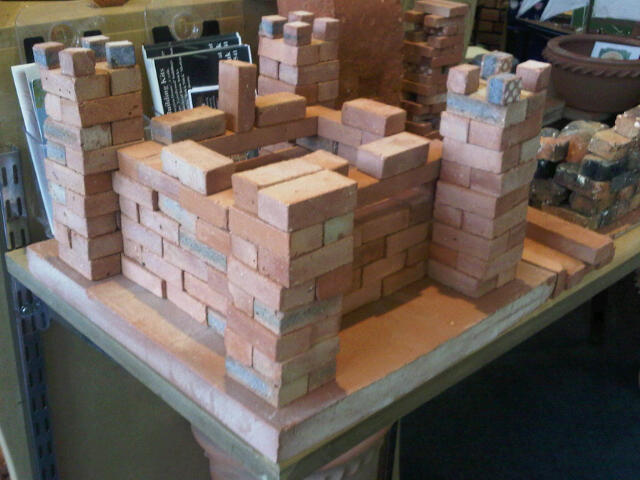 Maxi Bricks built loose into a castle of 25cm sq by 18cm High. Maxi bricks are 48*24*16mm in size and are excellent items of 'play' and at 18p each are a good 'pocket money' toy