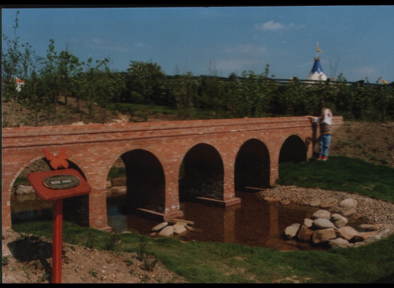 3 year old Arthur Bristow standing next to Model aquaduct made with York Handmade Mini Bricks at Gateshead Garden Festival 1990